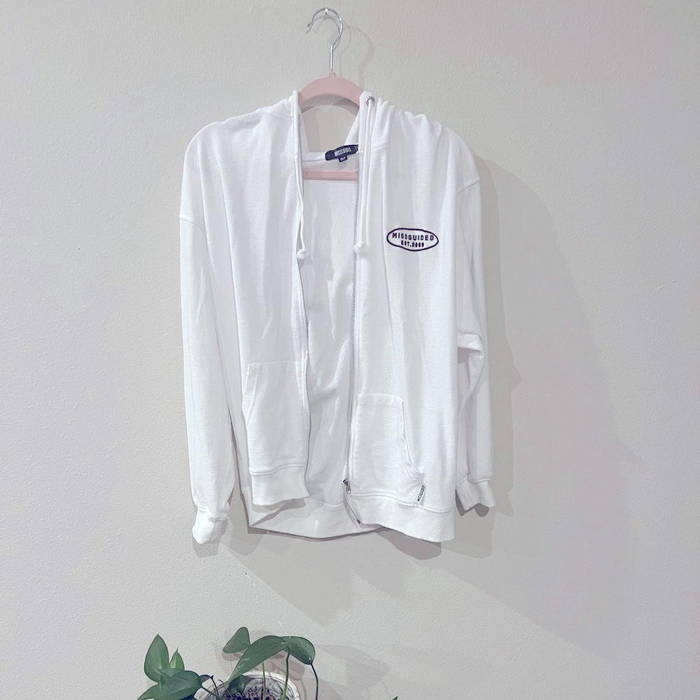 White zip up hoodie.